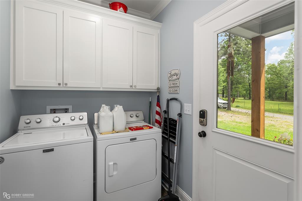 260 Circle M Road Benton, LA 71006 - Photo 23 of 30 a utility room with dryer and washer