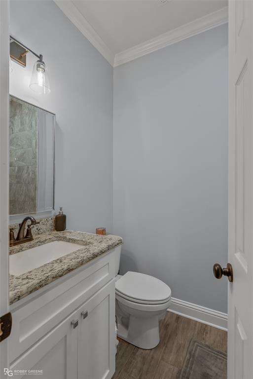 260 Circle M Road Benton, LA 71006 - Photo 23 of 35 a bathroom with a granite countertop toilet a sink and a mirror