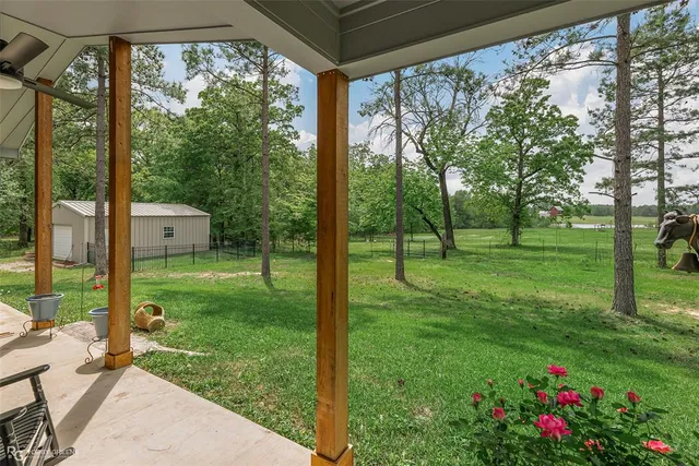 a view of a house with backyard from a porch