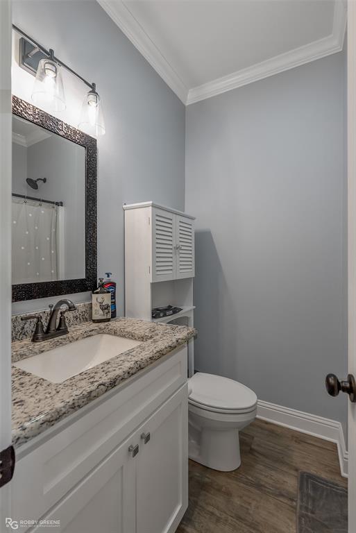 260 Circle M Road Benton, LA 71006 - Photo 26 of 35 a bathroom with a granite countertop toilet sink and mirror