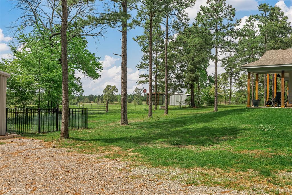 260 Circle M Road Benton, LA 71006 - Photo 31 of 35 a view of a park with plants and trees