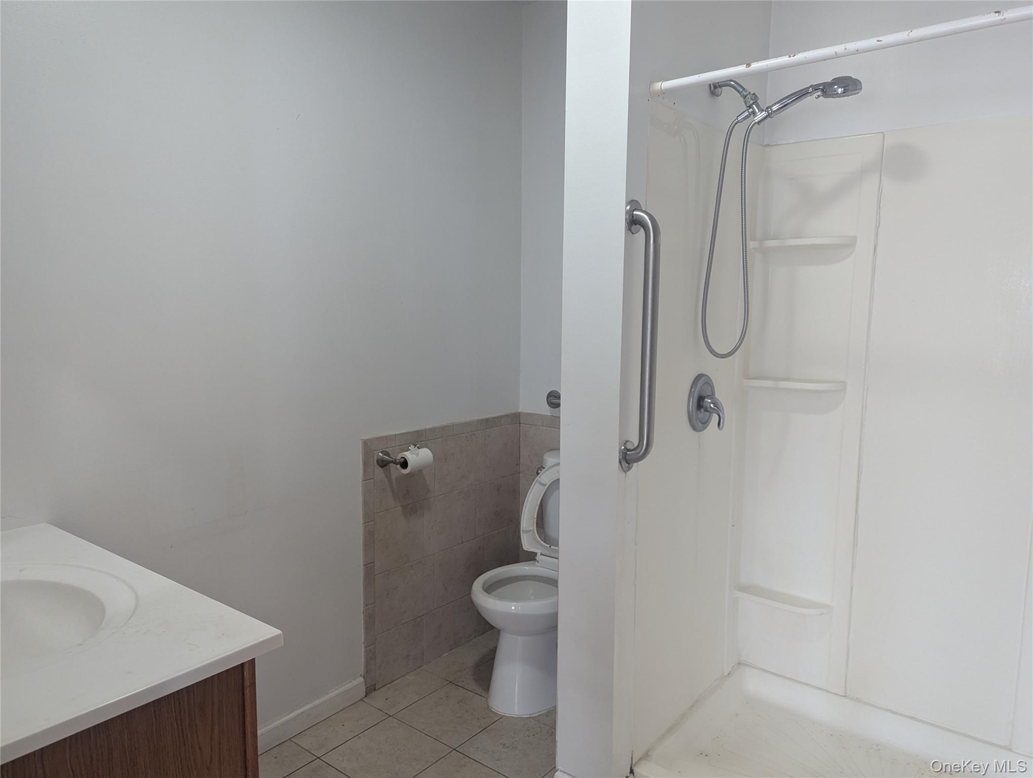 265 Goodwill Road Montgomery, NY 12549 - Photo 11 of 41 Bathroom featuring tile patterned floors, a shower, and vanity