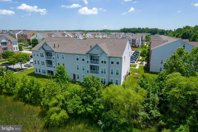 an aerial view of a house with a garden