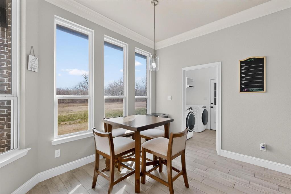 129 Altom Road Springtown, TX 76082 - Photo 14 of 40 a dining room with furniture and window