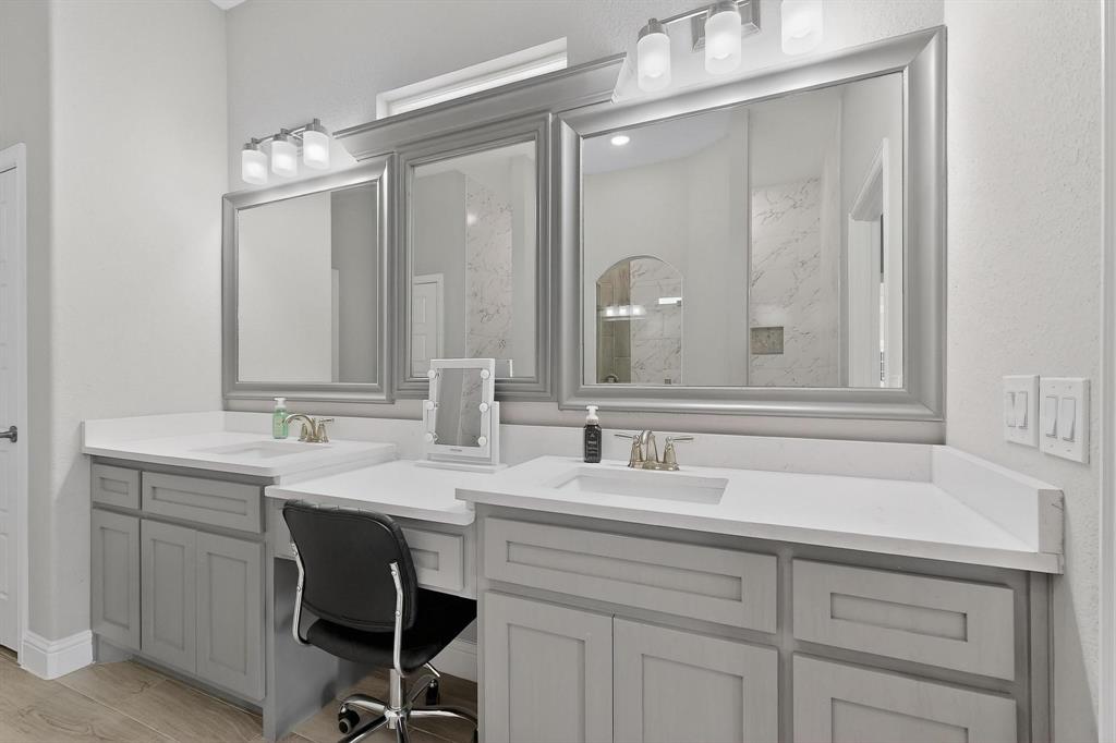 129 Altom Road Springtown, TX 76082 - Photo 18 of 40 a bathroom with a sink double vanity and a mirror