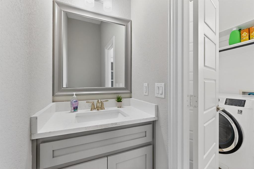 129 Altom Road Springtown, TX 76082 - Photo 23 of 40 a bathroom with a sink and a mirror