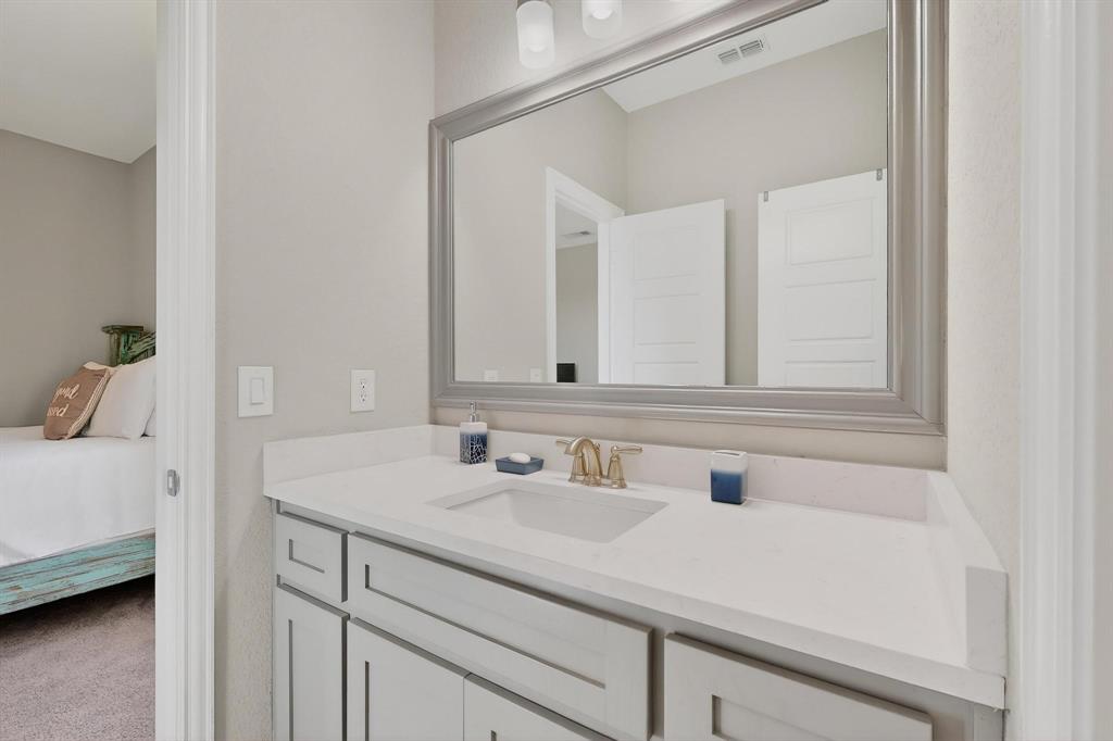 129 Altom Road Springtown, TX 76082 - Photo 32 of 40 a bathroom with a sink and a mirror