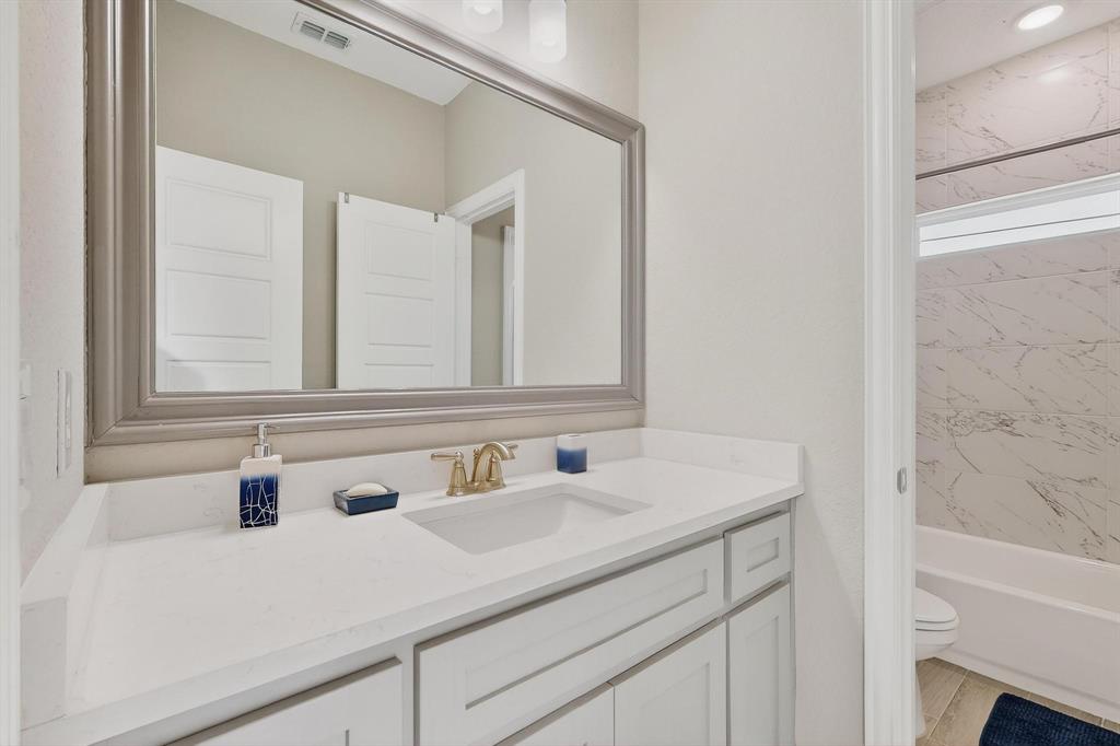 129 Altom Road Springtown, TX 76082 - Photo 33 of 40 a bathroom with a sink and a mirror