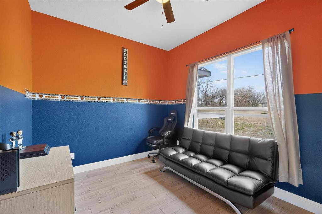 129 Altom Road Springtown, TX 76082 - Photo 36 of 40 a living room with furniture and a window
