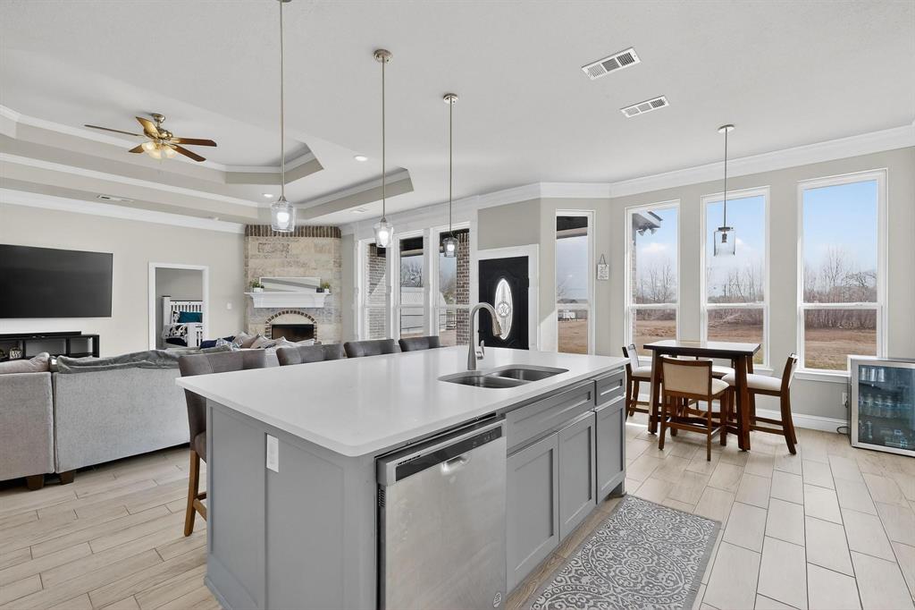 129 Altom Road Springtown, TX 76082 - Photo 9 of 40 a view of kitchen with sink and refrigerator