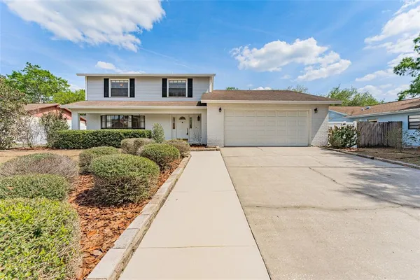 a front view of a house with yard