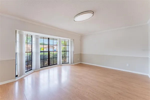 a view of hallway with wooden floor