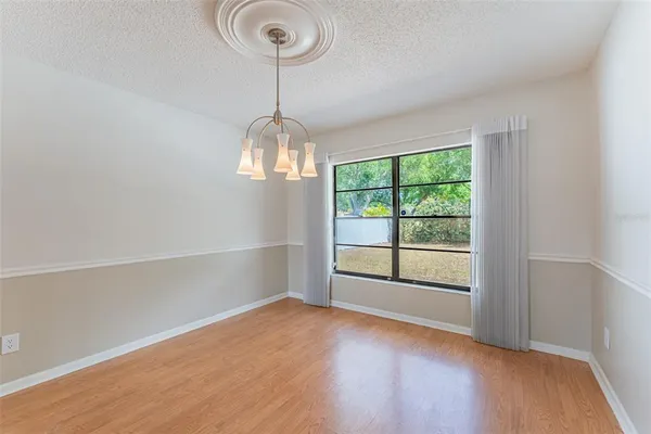 a view of an empty room with a ceiling fan
