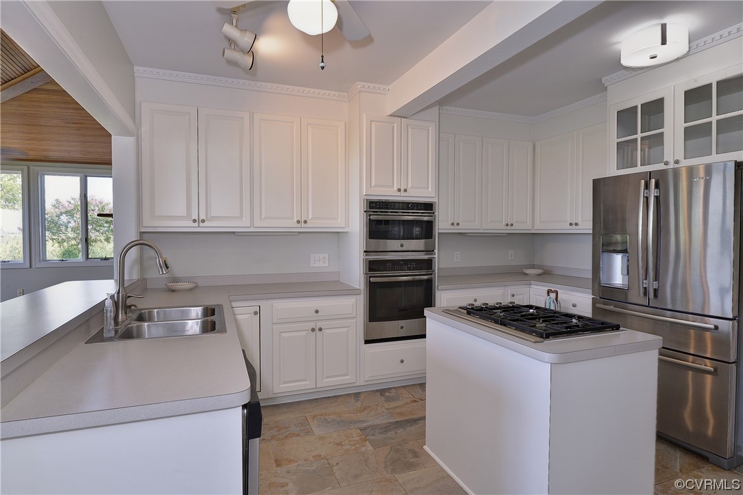 528 10th Street West Point, VA 23181 - Photo 11 of 50 a kitchen with granite countertop a sink stainless steel appliances and cabinets