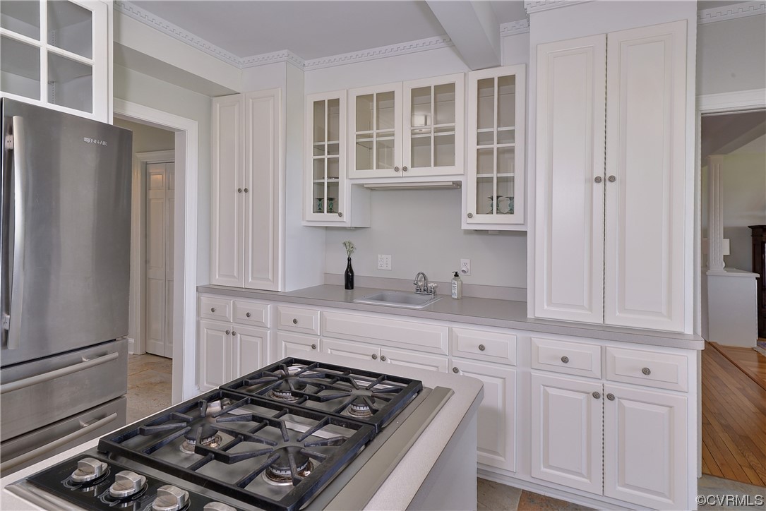 528 10th Street West Point, VA 23181 - Photo 12 of 50 a kitchen with white cabinets and appliances
