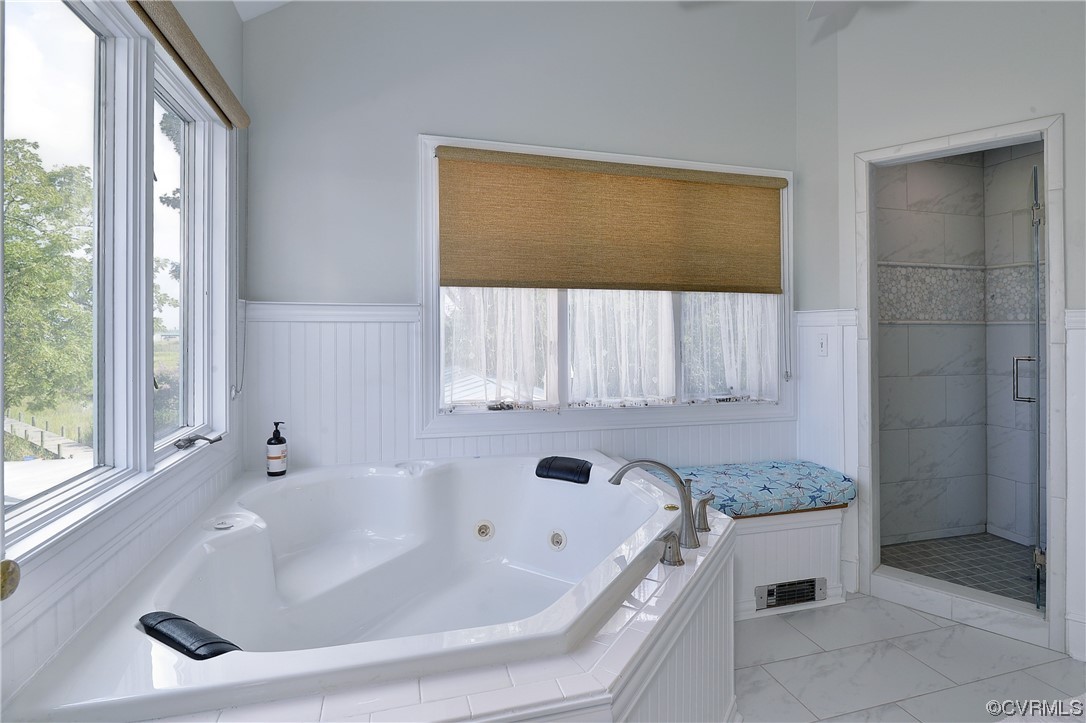 528 10th Street West Point, VA 23181 - Photo 21 of 50 a bathroom with a tub sink and window