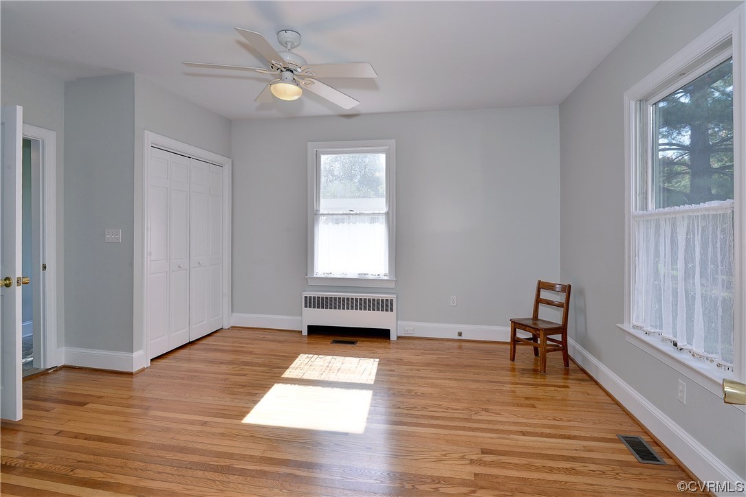 528 10th Street West Point, VA 23181 - Photo 25 of 50 an empty room with wooden floor and windows