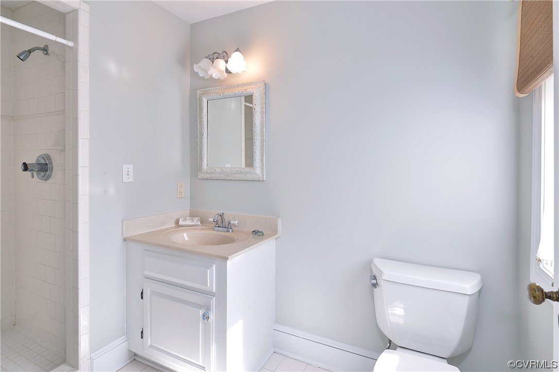 528 10th Street West Point, VA 23181 - Photo 28 of 50 a bathroom with a toilet sink and mirror