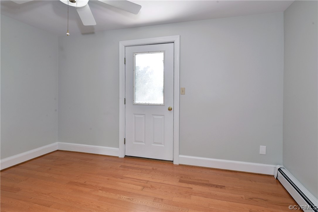 528 10th Street West Point, VA 23181 - Photo 29 of 50 a view of an empty room with wooden floor and a window
