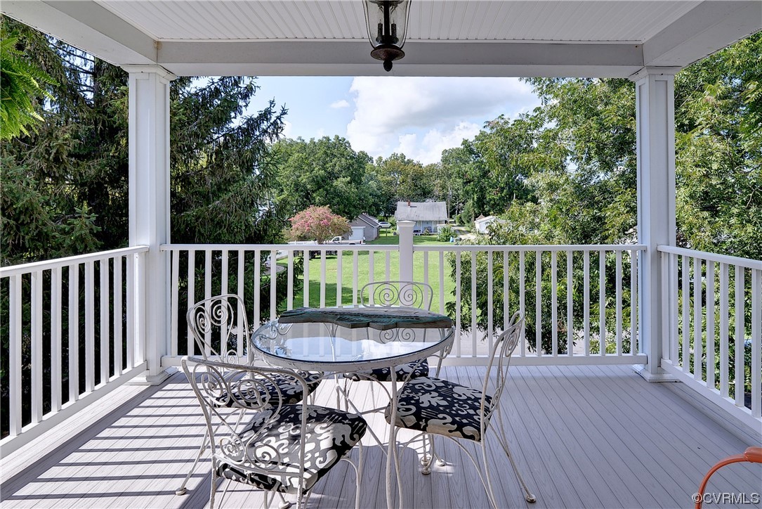 528 10th Street West Point, VA 23181 - Photo 33 of 50 a view of a balcony with wooden floor and outdoor seating