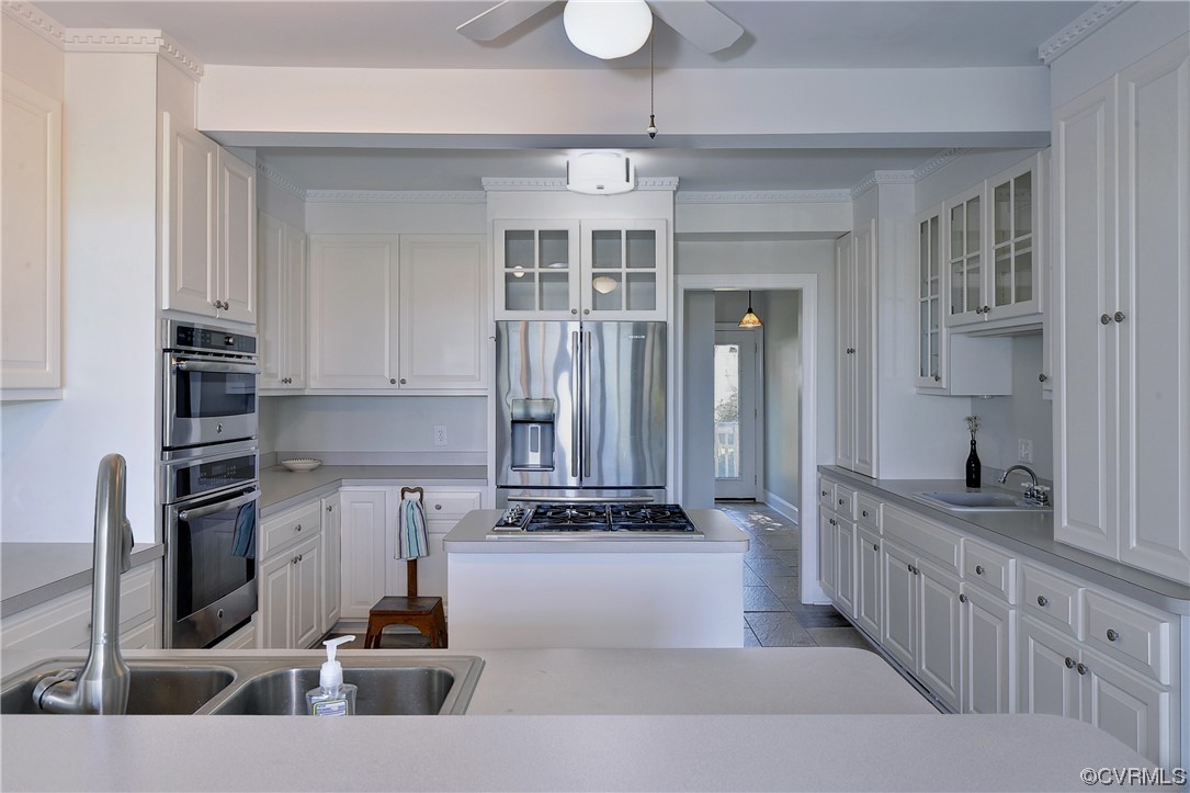 528 10th Street West Point, VA 23181 - Photo 10 of 50 a kitchen with stainless steel appliances granite countertop a sink and cabinets