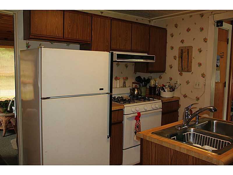 646 Newell Brook Road Durham, ME 04222 - Photo 15 of 34 Kitchen. Sun porch off kitchen to left