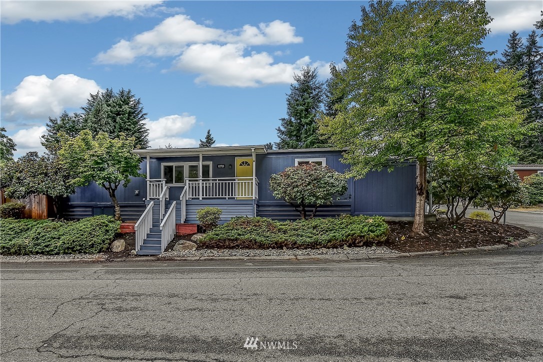 12723 Northeast 199th Street Bothell, WA 98011 - Photo 1 of 34 a front view of a house with garden