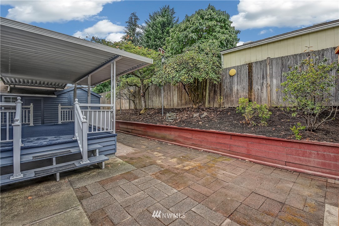 12723 Northeast 199th Street Bothell, WA 98011 - Photo 30 of 34 a view of a backyard with plants and a patio