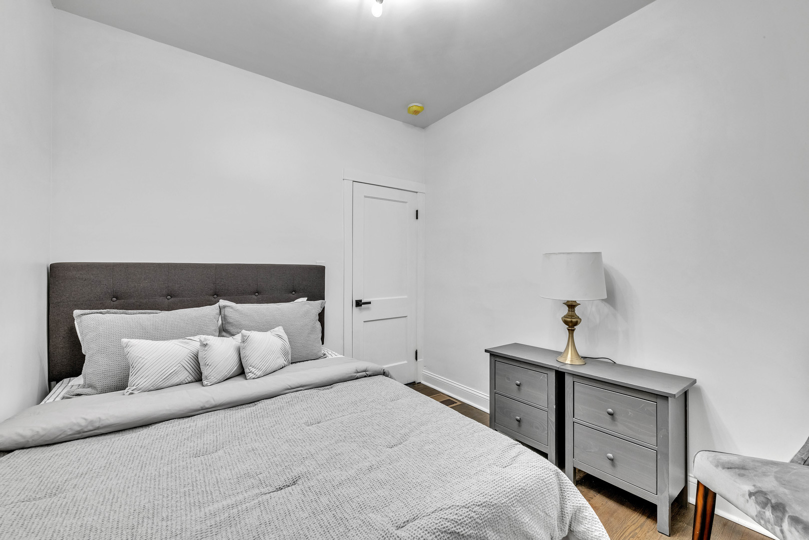 4844 West 23rd Street Cicero, IL 60804 - Photo 11 of 36 a bedroom with a bed and a night stand