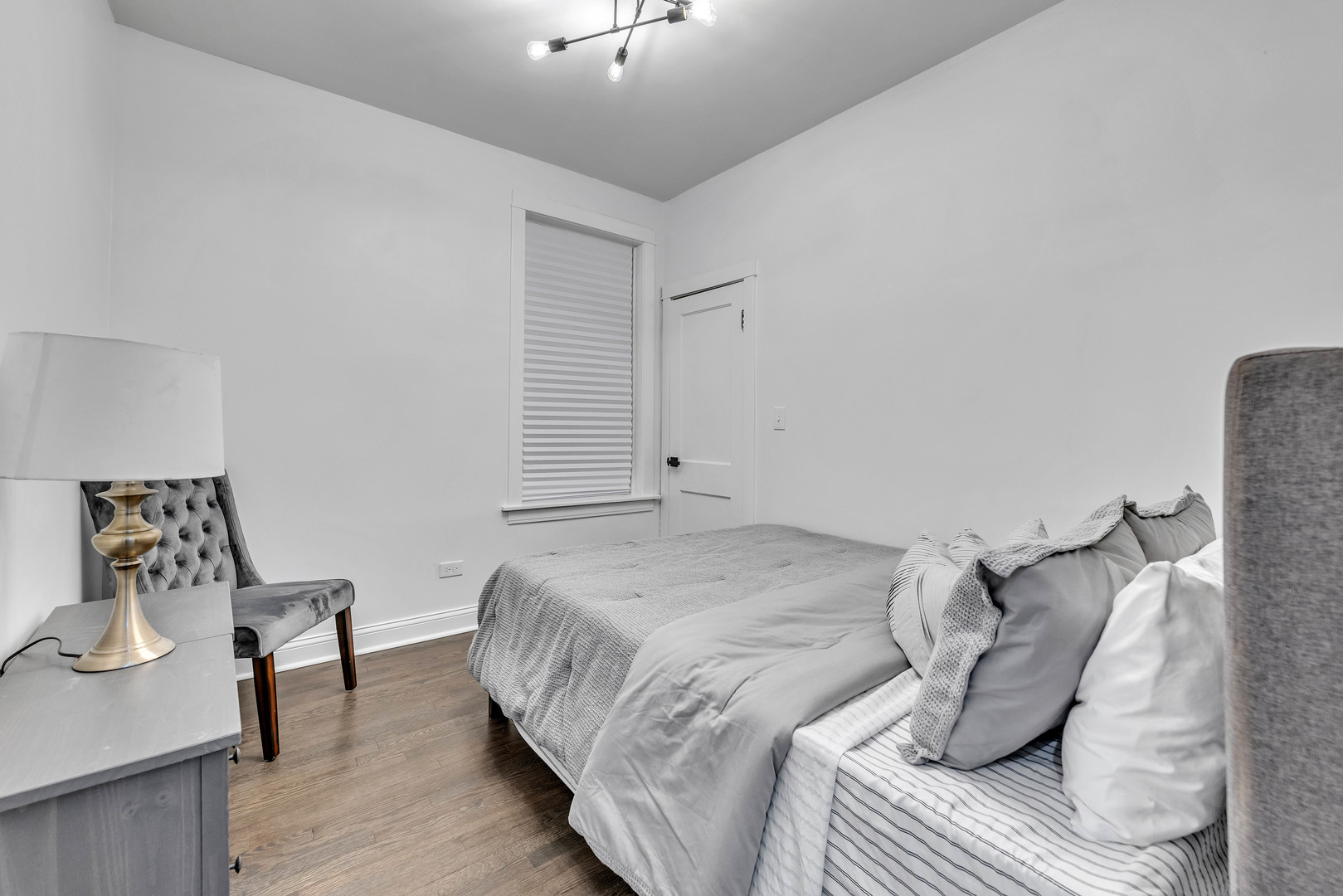 4844 West 23rd Street Cicero, IL 60804 - Photo 12 of 36 a bedroom with a bed and a table