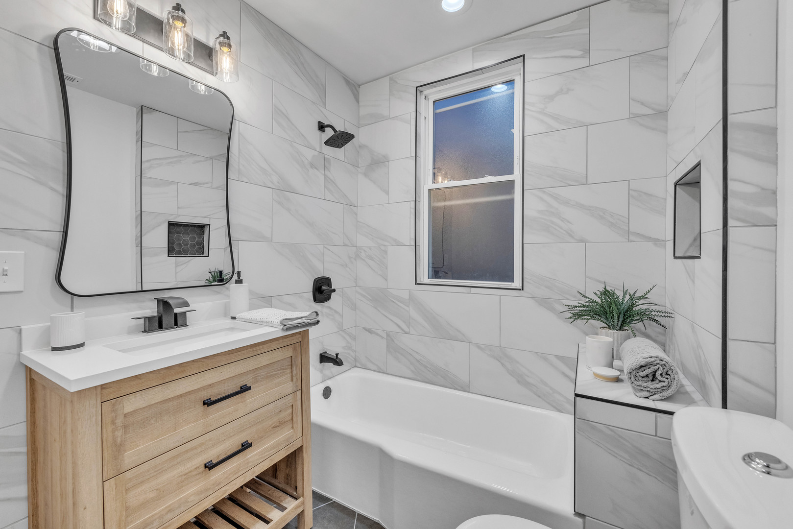 4844 West 23rd Street Cicero, IL 60804 - Photo 25 of 36 a bathroom with a tub sink and mirror