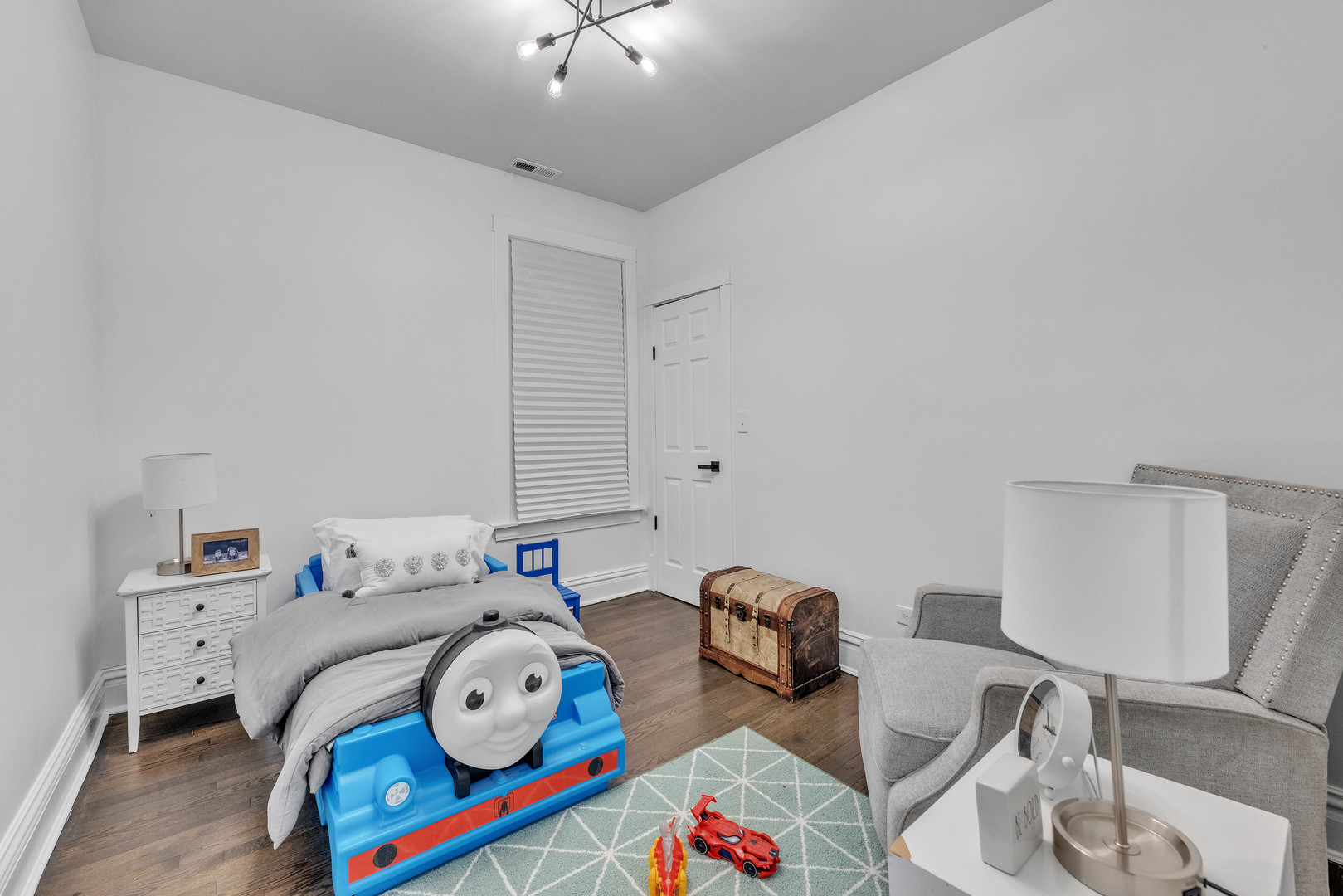 4844 West 23rd Street Cicero, IL 60804 - Photo 26 of 36 a bedroom with furniture and a chandelier