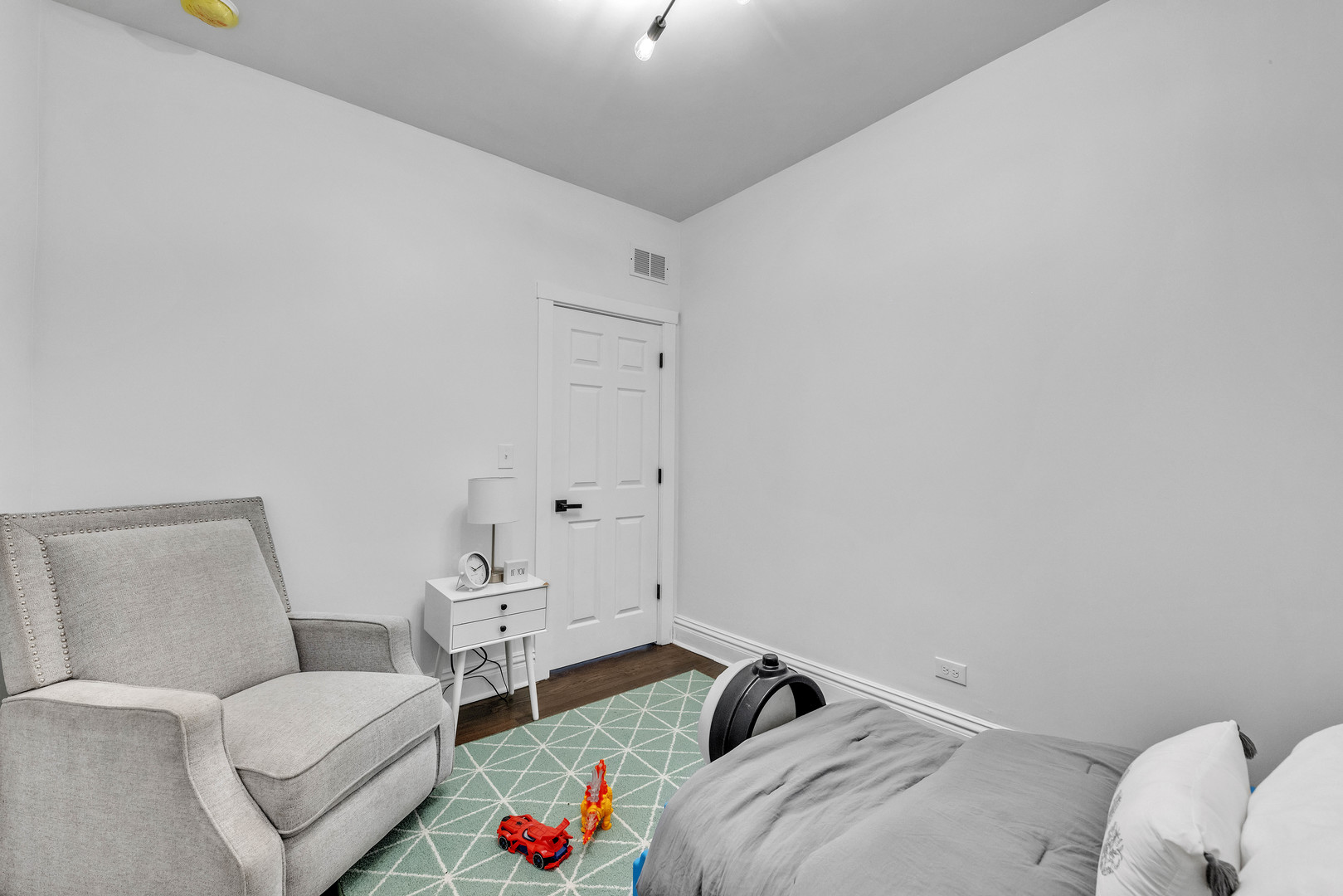 4844 West 23rd Street Cicero, IL 60804 - Photo 27 of 36 a bedroom with a bed and a couch