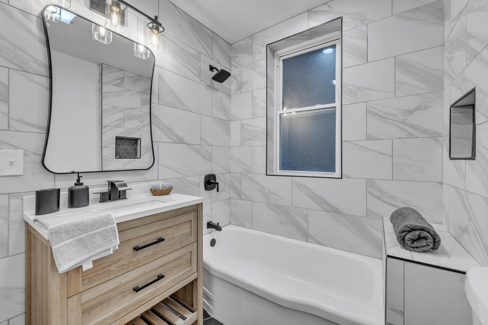 4844 West 23rd Street Cicero, IL 60804 - Photo 9 of 36 a bathroom with a sink and a bathtub