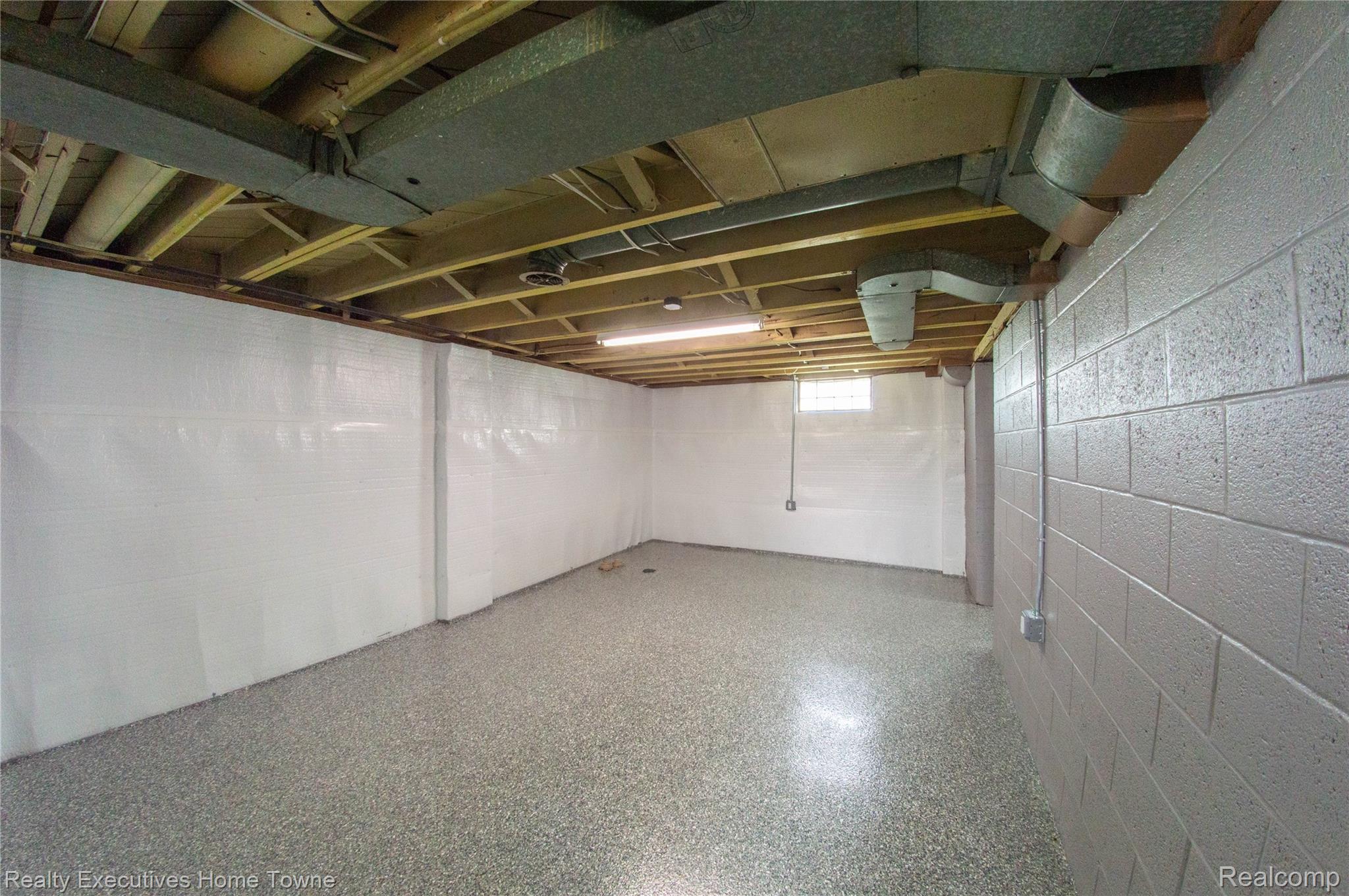 2676 Cumberland Road Berkley, MI 48072 - Photo 27 of 38 Lower level featuring sealed concrete block walls and a speckled epoxy floor