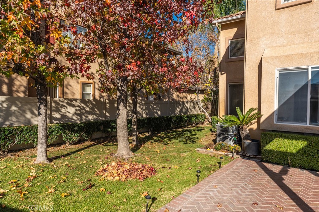 9749 Orange Street Rancho Cucamonga, CA 91737 - Photo 34 of 38 a view of a yard with plants and large trees