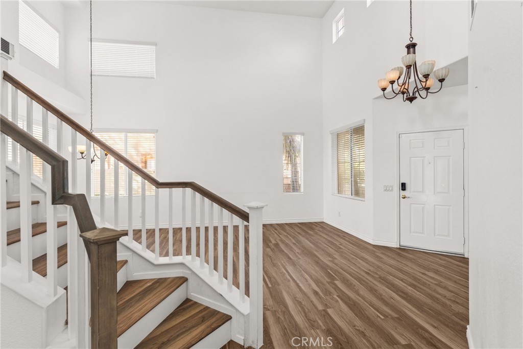 9749 Orange Street Rancho Cucamonga, CA 91737 - Photo 5 of 38 a view of an entryway with wooden floor