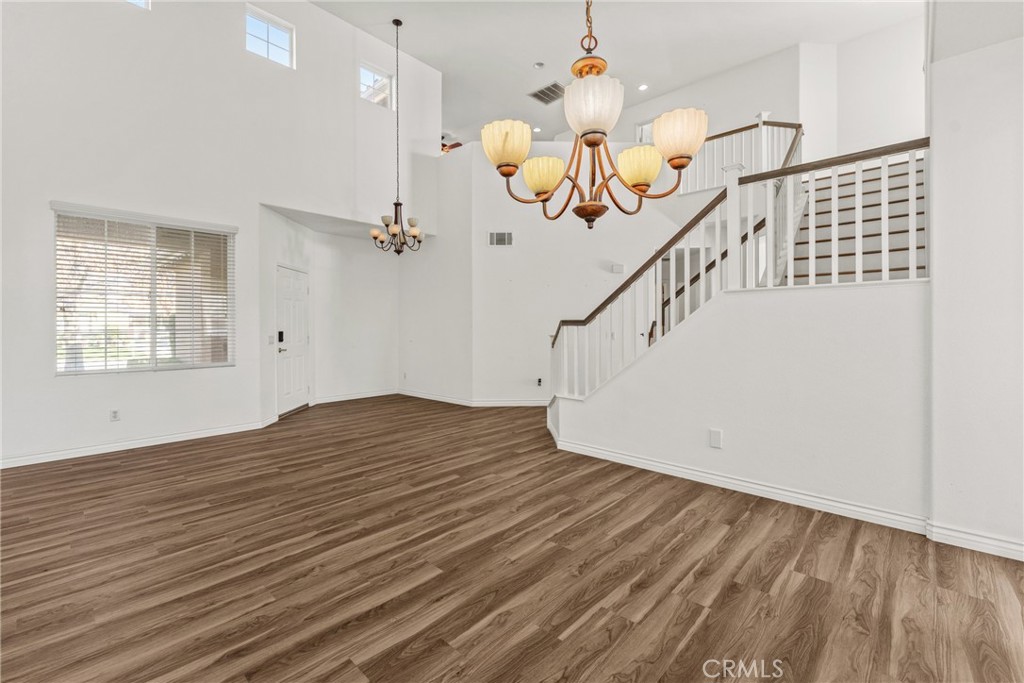 9749 Orange Street Rancho Cucamonga, CA 91737 - Photo 8 of 38 a view of entryway and hall with wooden floor