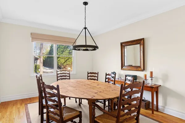 a view of a dining room with furniture window and outside view