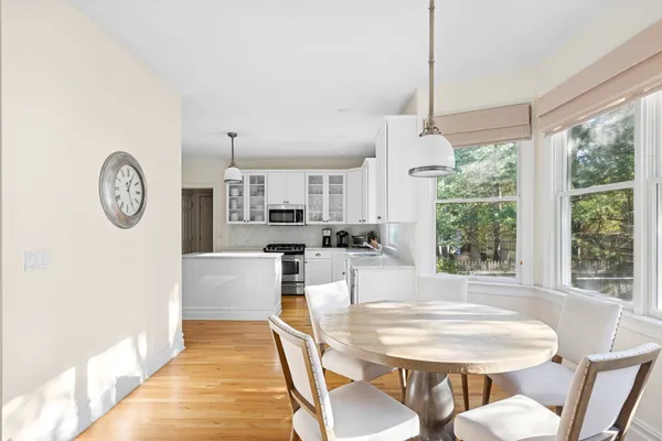 a view of a dining room with furniture window and outside view