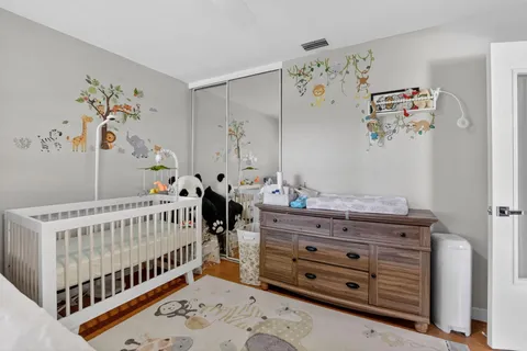 a bedroom with a bed and chair