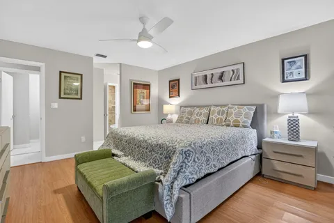 a bedroom with a bed and a couch