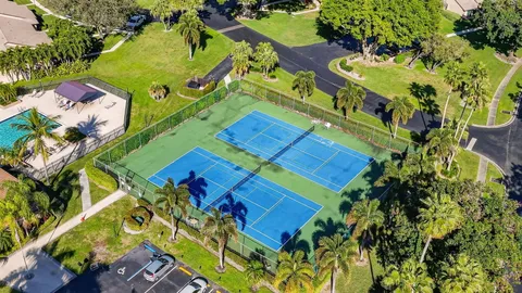 an aerial view of a pool yard swimming pool and outdoor seating