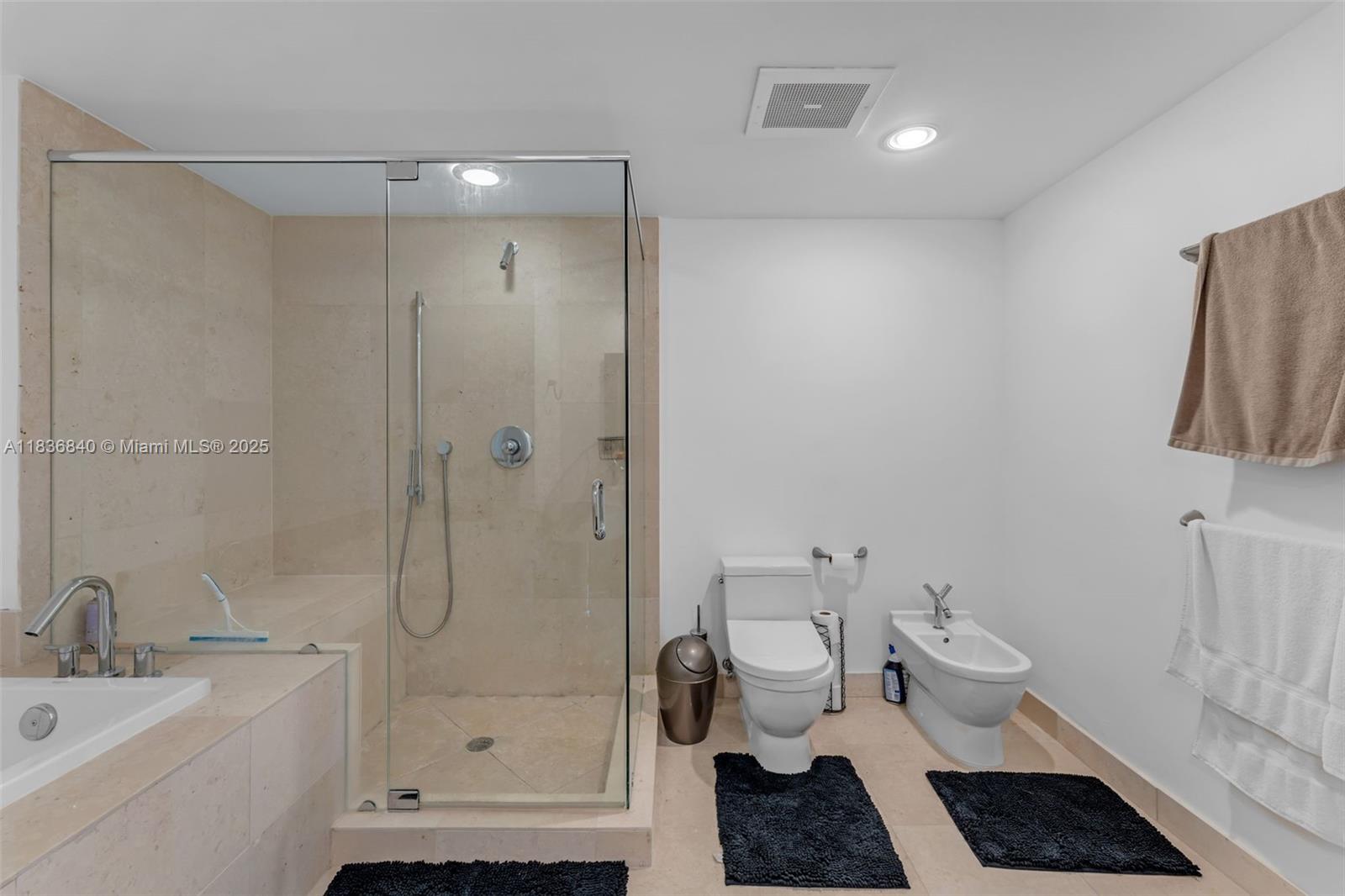 495 Brickell Avenue, Unit BAY1007 Miami, FL 33131 - Photo 16 of 34 a bathroom with a toilet a sink and shower