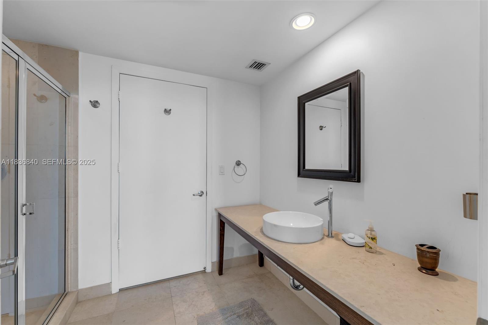 495 Brickell Avenue, Unit BAY1007 Miami, FL 33131 - Photo 22 of 34 a bathroom with a sink double vanity and a mirror