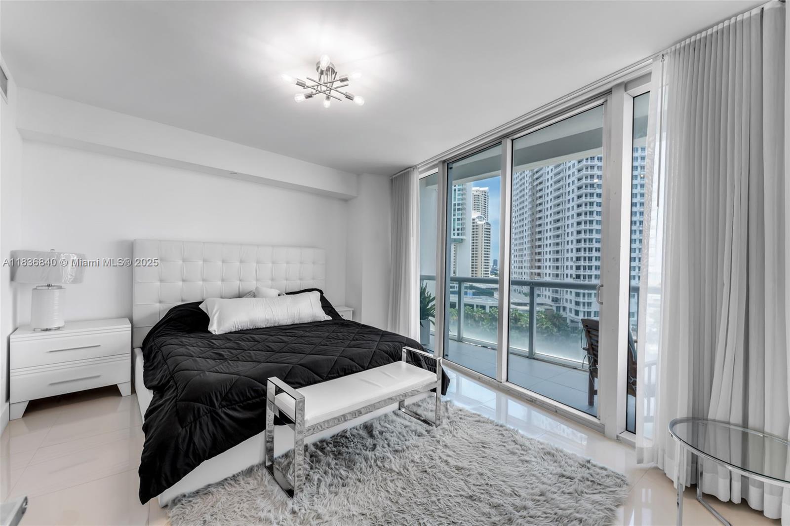 495 Brickell Avenue, Unit BAY1007 Miami, FL 33131 - Photo 9 of 34 a bedroom with a bed and a window
