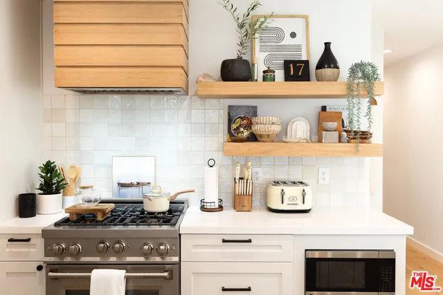 a kitchen with a stove and cabinets