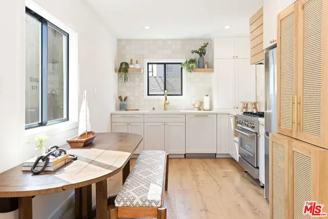 a kitchen with a sink stove and refrigerator