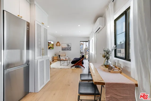 a very nice looking dining room with a dining table and chairs