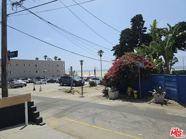 a view of a street with sitting area